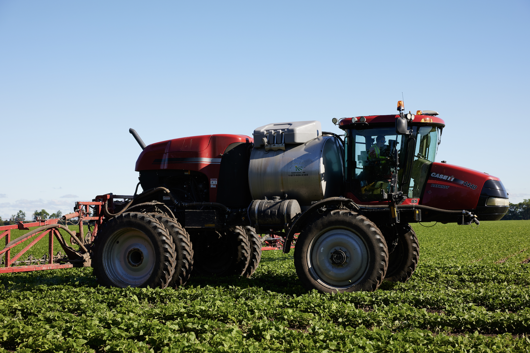 Sprayer moving in a field.