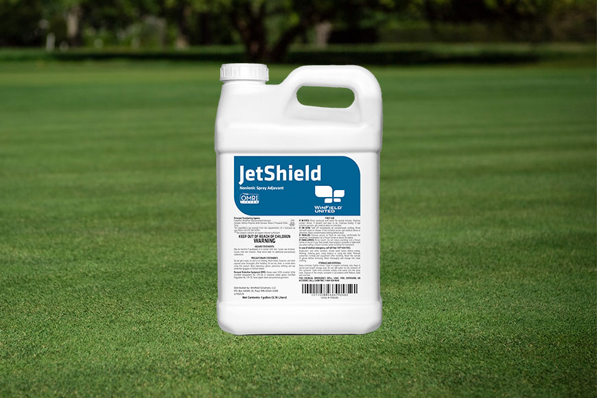 JetShield jug sitting on grass