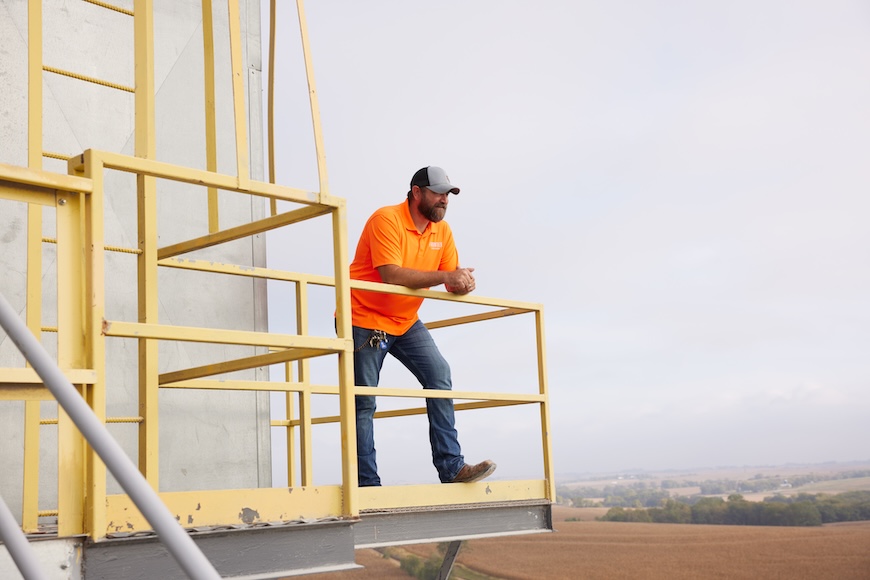 Co-op employee looking out at a field