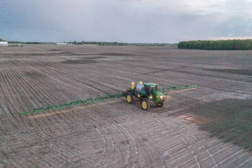 Drone shot of a grower applying a pre-emergence herbicide