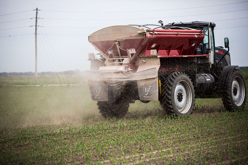 Truck applying micronutrients to early-season corn crop